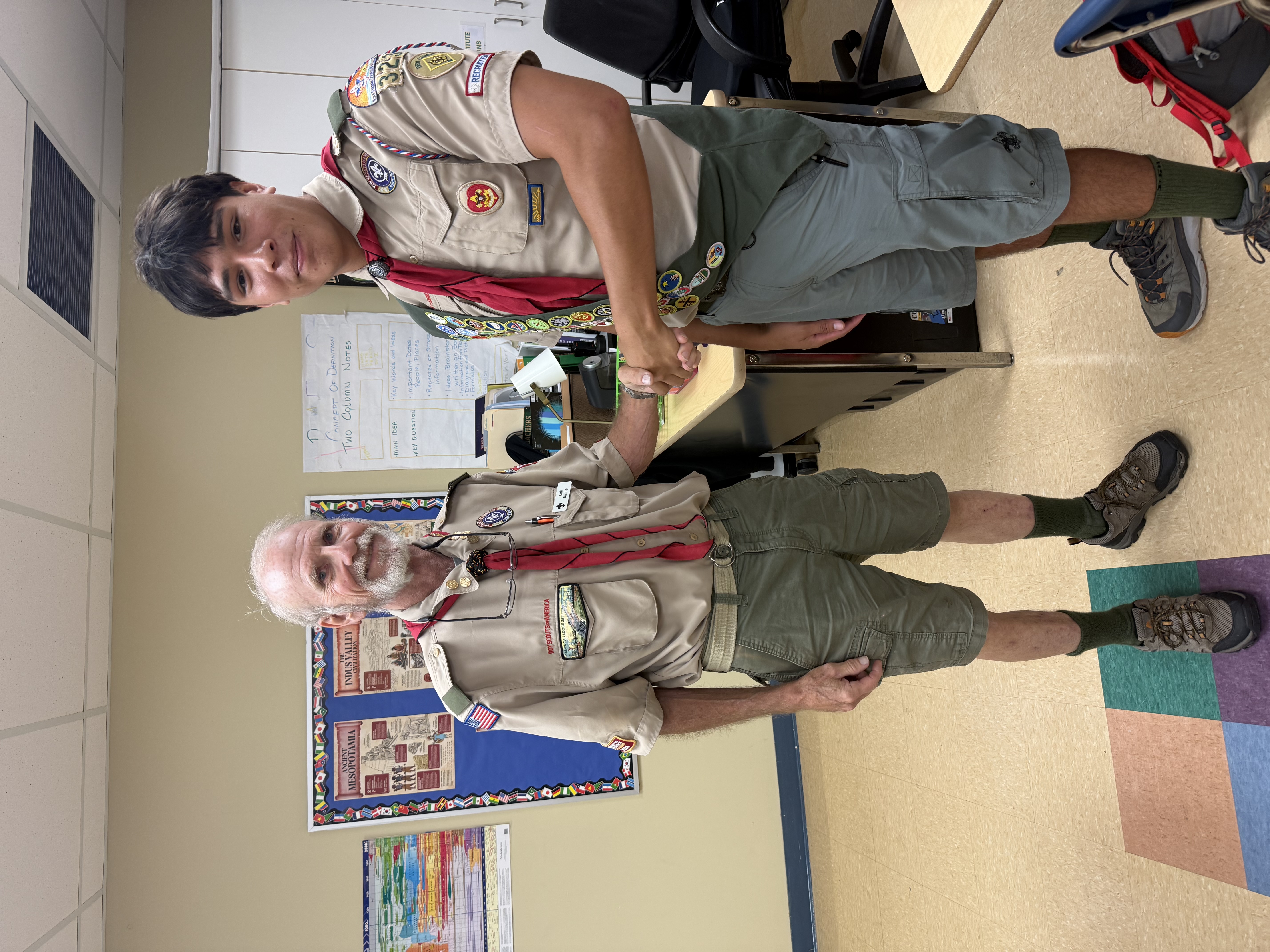 Jack shaking hands with Kirk Milner, his Eagle Scout coach
