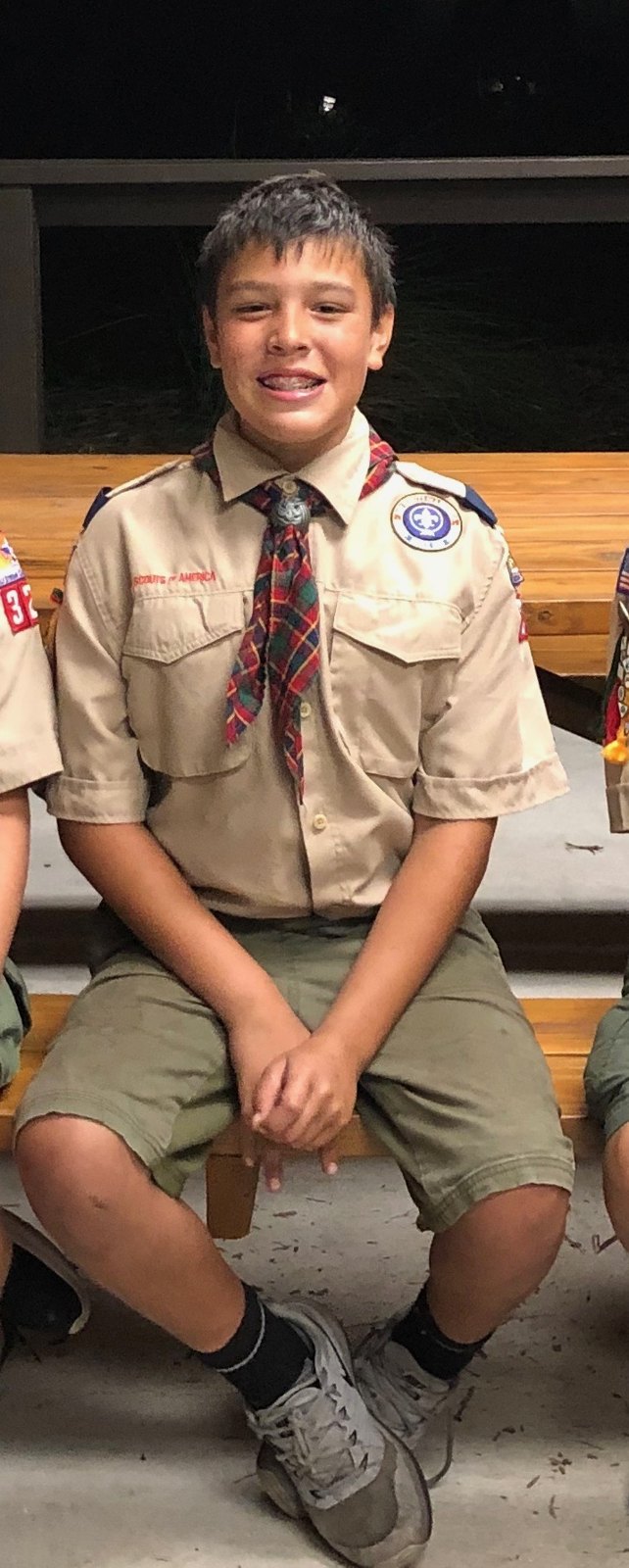 Jack seated in his Scout uniform during his earlier Scouting years